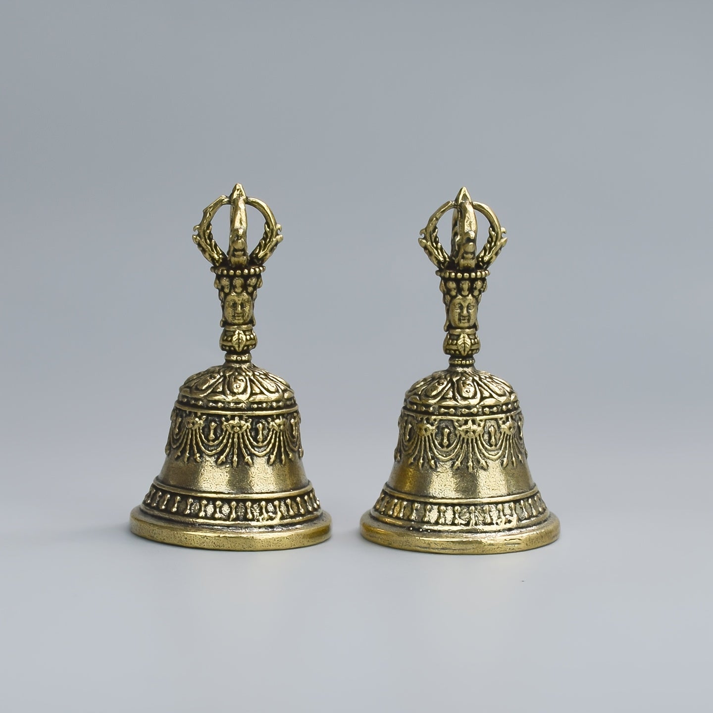 one carved bronze bell hand held shaker clapping handle